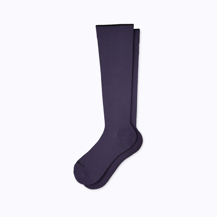 A pair of nylon knee high compression socks in navy solid