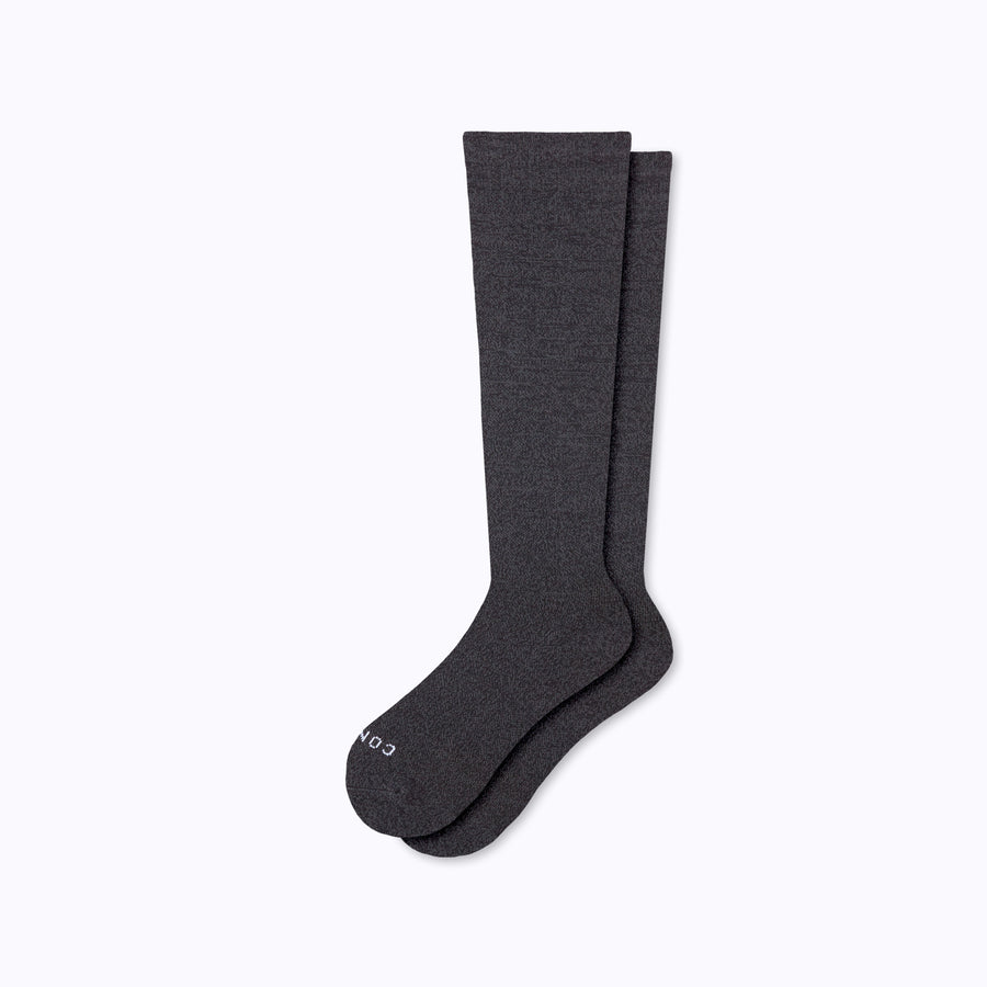 A pair of nylon knee high compression socks in heather-charcoal solid