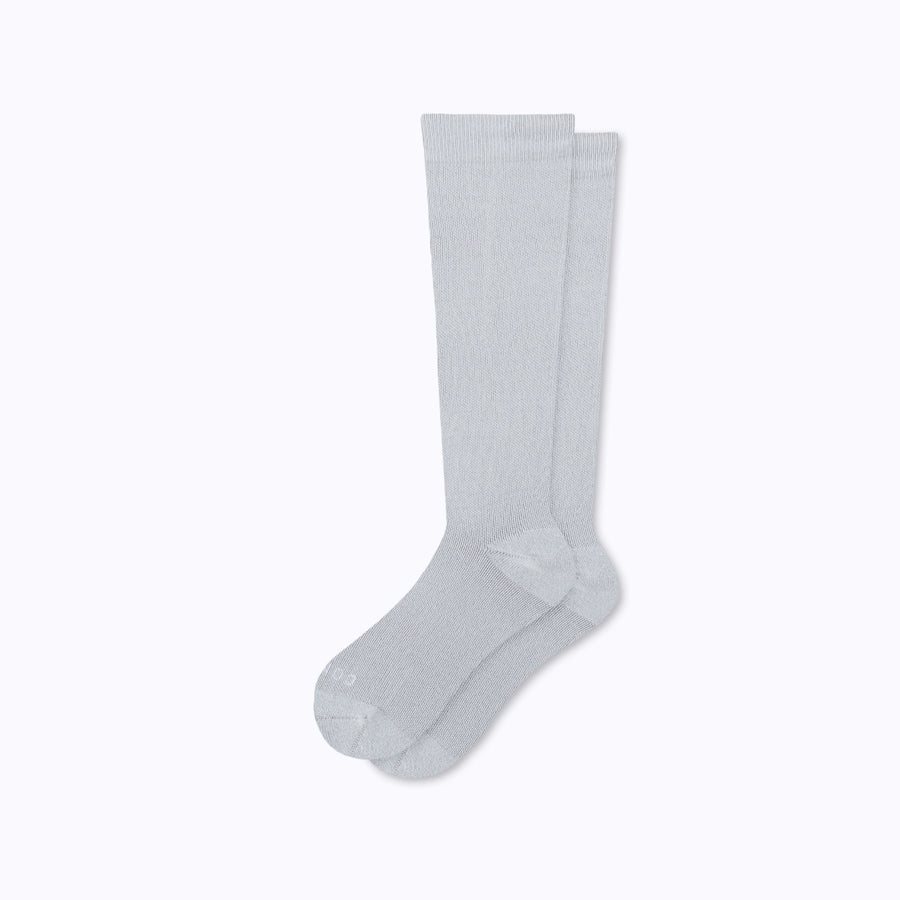 A pair of nylon knee high socks compression in heather-grey solid
