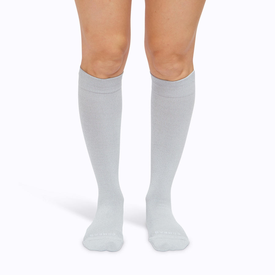 Front view of legs wearing a nylon knee high socks compression in heather-grey solid