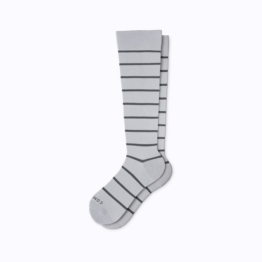 A pair of nylon knee high socks in grey-charcoal stripes