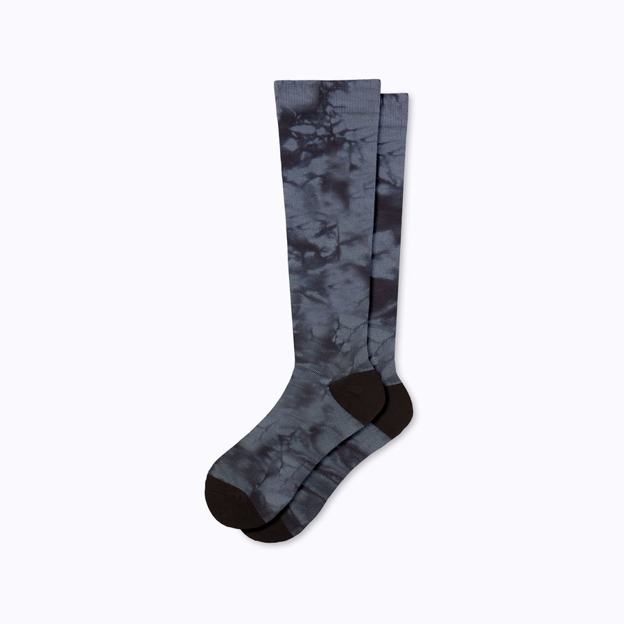 A pair of nylon knee high socks compression in black twist-dye